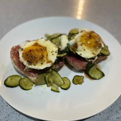 A picture of Warm green salad and poached egg.