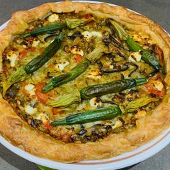 A picture of Corsican pie with zucchini flowers.