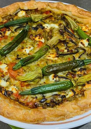 A picture of Corsican pie with zucchini flowers.
