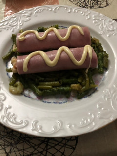 Una foto de Rollitos de jamón dulce con base de espárragos salteados