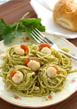 A picture of Basil pesto pasta with scallops.