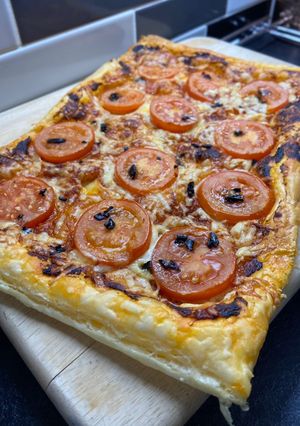 A picture of ‘Nduja pastry with Black Garlic drizzle.