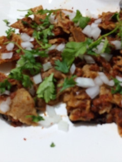 Una foto de Chilaquiles de cascabel y tomatillo de milpa al pulque las Correa