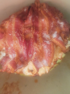 A picture of Bacon-Wrapped, Meatball Stuffed Cabbage w/sauce.