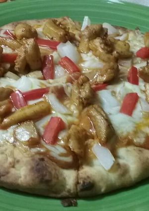 A picture of Chicken Tikka Masala Pizza.