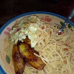 A picture of Indomine and fried plantain and egg.