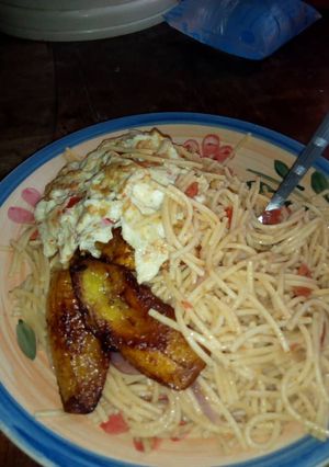 A picture of Indomine and fried plantain and egg.