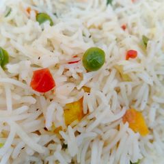 A picture of Eggs and vegetable fried rice.
