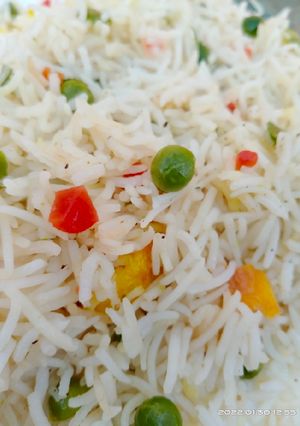 A picture of Eggs and vegetable fried rice.