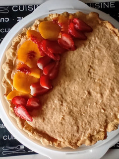 Una foto de Tarta de queso mascarpone y duraznos frescos