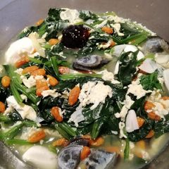 A picture of Trio Eggs w/Spinach in Soup.