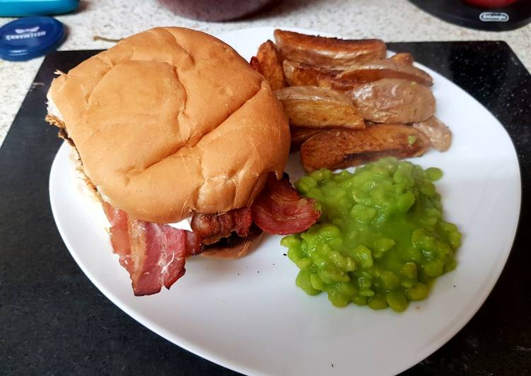 My Mega Chicken Burger with potato wedgies and mushie peas. 😁