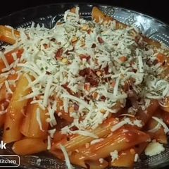 A picture of Red sauce pasta only with two main ingredients.