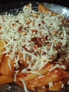A picture of Red sauce pasta only with two main ingredients.