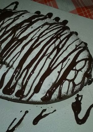 Una foto de Budín XL de pasas nueces y chocolate amargo