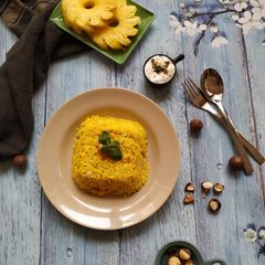 A picture of Pineapple pulao with macadamia nuts.