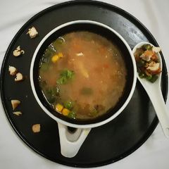 A picture of Broken Wheat Chicken Soup with Roasted vegetables.