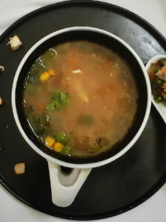 A picture of Broken Wheat Chicken Soup with Roasted vegetables.