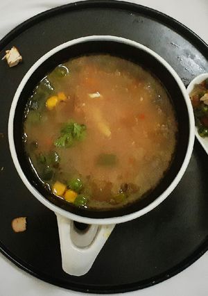 A picture of Broken Wheat Chicken Soup with Roasted vegetables.