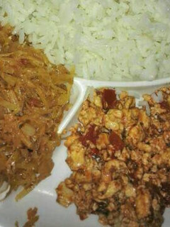 A picture of Scrambled eggs, fried cabbage and plain rice.