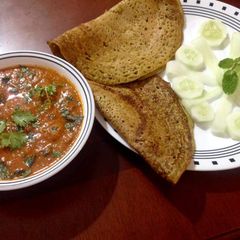 Mung masoor chila with meatballs in tangy tomato gravy A picture of Mung masoor chila with meatballs in tangy tomato gravy.