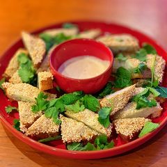 A picture of Prawn Toast with Yuzu Mayo, Coriander and Mint.