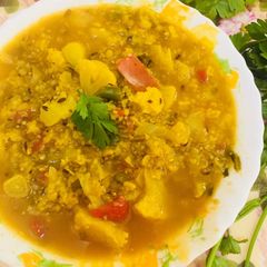 A picture of Veggie daliya curry.