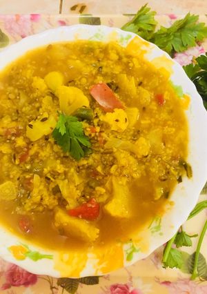 A picture of Veggie daliya curry.