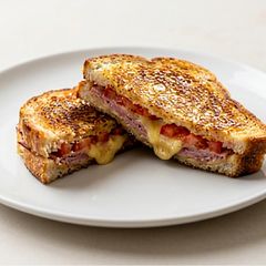 A picture of Classic Ham, Cheese, and Tomato Toasties.