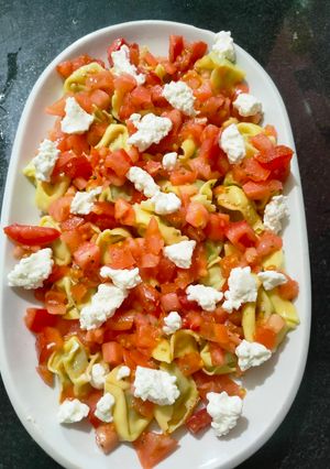 Foto principal de Ravioli de espinaca con queso y tomate