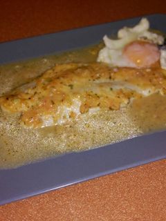 Una foto de Panga al horno en salsa de ajo y limón