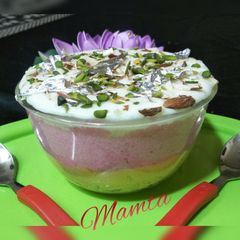 A picture of Tripe layered custard rice pudding with twist of chocolate.