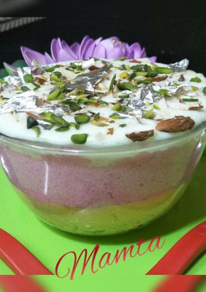 A picture of Tripe layered custard rice pudding with twist of chocolate.