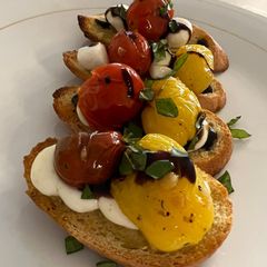 A picture of Bruschetta and Mozzarella on Crostini.