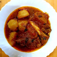 A picture of SHALJUM GHOST Turnip meat curry.