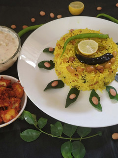 A picture of Lemon Rice With Masala curd.