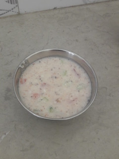 A picture of Cucumber and tomato raita.