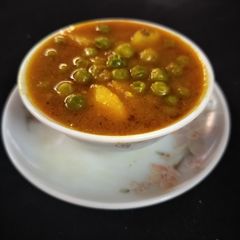 A picture of Aloo green peas curry.