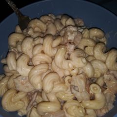 A picture of Bacon Alfredo with shrimp and mushrooms.