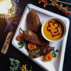A picture of Peri bites with twist and mustard dynamite sauce.