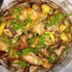 Baked chicken with lemon, potato and green olives A picture of Baked chicken with lemon, potato and green olives.