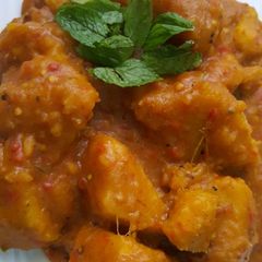 A picture of Yam porridge garnished with mint leaf for coolness.