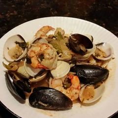 A picture of Brad's seafood in white wine and garlic reduction.