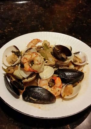 A picture of Brad's seafood in white wine and garlic reduction.