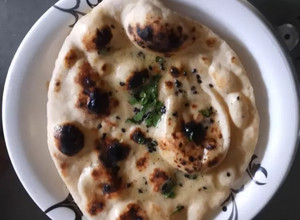 A picture of Dhaba style tawa Butter Naan.