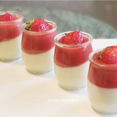 A picture of Vanilla Panna Cotta with Strawberry Sauce.