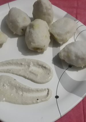 A picture of Pitha with peanut chutni.