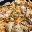 Pollito con arroz integral, zanahoria, verdeo y semillas de girasol junto a @cocinacaseraya