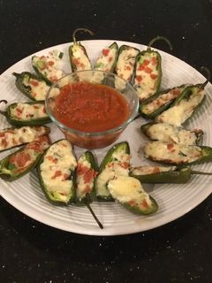 A picture of Roasted Pepperoni and cheese stuffed Jalapeños.