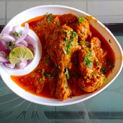 A picture of Chicken tangdi in red goan masala.